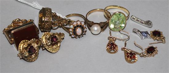 Mixed gold jewellery including rings, seals and ear clips.